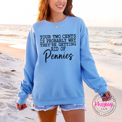 Close up of the script Pennies punchline on a Carolina Blue crewneck sweatshirt.